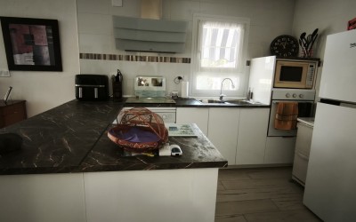 A fully renovated corner bungalow with a large garden.